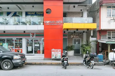 two motorcycles parked in front of a building at RedDoorz near Bambang Station in Manila