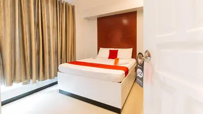 a small bed in a room with a door at RedDoorz near Bambang Station in Manila