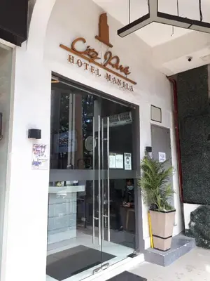 a hotel miami sign on the front of a building at City Park Hotel Residences in Manila