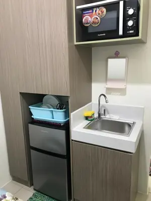 a small kitchen with a sink and a microwave at Shanilyn Residency Urban Deca Towers EDSA mandaluyong UNLIMITED INTERNET AND NETFLIX in Manila