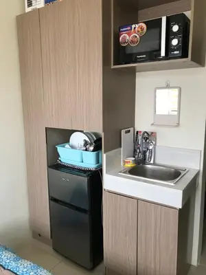 a small kitchen with a sink and a microwave at Shanilyn Residency Urban Deca Towers EDSA mandaluyong UNLIMITED INTERNET AND NETFLIX in Manila