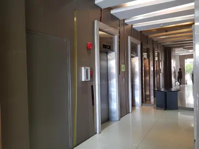 a hallway of elevators in a building at Stay Amare Residences Malate in Manila
