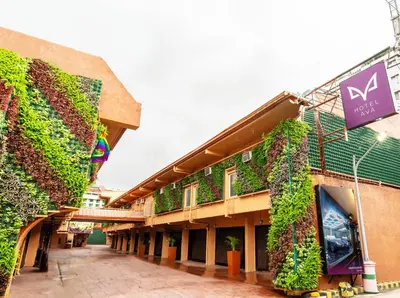 a building with ivy growing on the side of it at Hotel Ava Cuneta in Manila