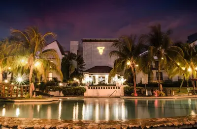 a resort with a swimming pool at night at Thunderbird Resorts - Rizal in Binangonan