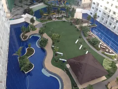 an aerial view of a resort with a swimming pool at Shore Residences MOA in Manila