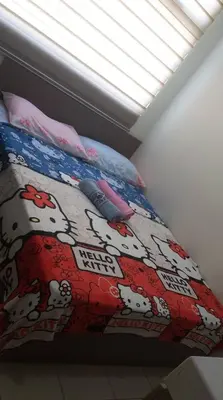 a bedroom with a bed with a mickey mouse bedspread at Superb Edsa Cheap Hotel @ Graceysplace Unit 2 in Manila