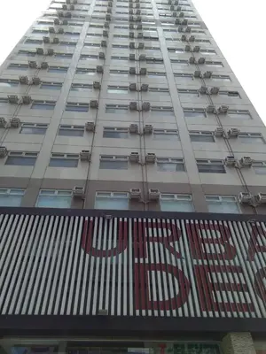 a tall building with a pepsi sign on it at Superb Edsa Cheap Hotel @ Graceysplace Unit 2 in Manila