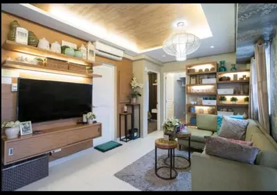 a living room with a large flat screen tv at Sta.Mesa across SM Model Unit 2 BR in Manila