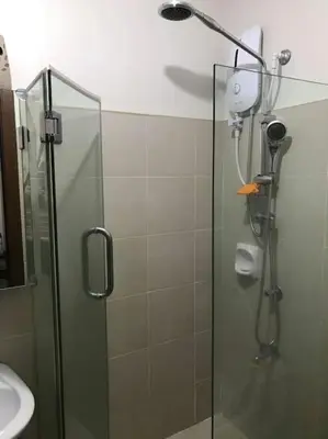 a shower in a bathroom with a glass door at Condotel Type in Manila