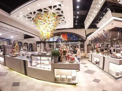 a store with a food counter in a mall at Condotel @JAZZ Residences in Manila