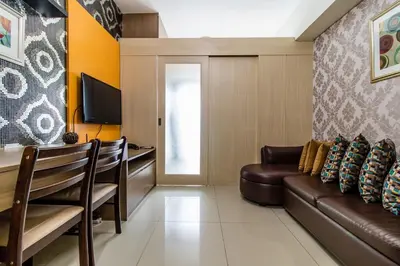 a living room with a couch and a table at Condotel @JAZZ Residences in Manila
