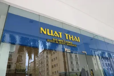 a building with a sign on the side of it at Eighty One Newport Boulevard in Manila