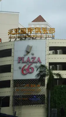 a sign on the side of a building at Eighty One Newport Boulevard in Manila