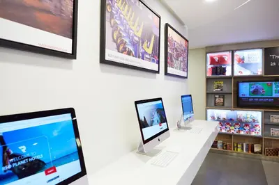 a display of apple computers on display in a store at Red Planet Makati Avenue Manila in Manila