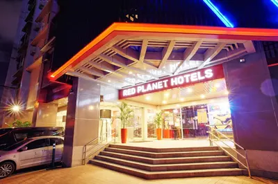 a building with a sign that reads hotel market hotels at Red Planet Makati Avenue Manila in Manila