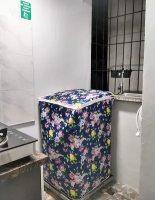 a flowery container sitting in a room at Affordable 2 BR 2 BA w/ Skycable, Netflix, & Amazon Prime in Manila