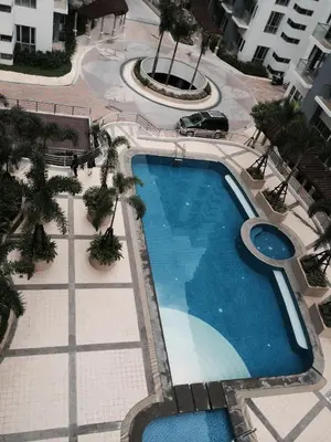 an overhead view of a swimming pool at a hotel at Resorts World Condo in Manila