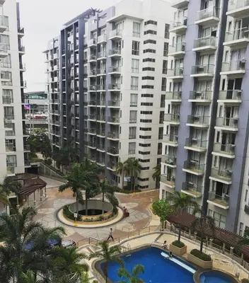 an aerial view of apartment buildings and a pool at Resorts World Condo in Manila
