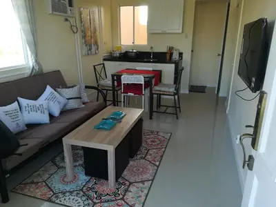 a living room with a couch and a table at Julzhome PH Properties by Juliet AfricaPervaze in Santa Rosa