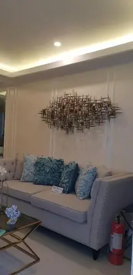 a living room with a couch and a chandelier at Julzhome PH Properties by Juliet AfricaPervaze in Santa Rosa