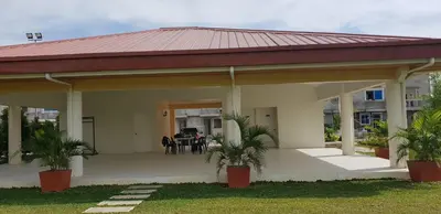 a house with a porch with a roof at Julzhome PH Properties by Juliet AfricaPervaze in Santa Rosa