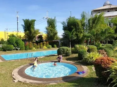 a group of children playing in a swimming pool at Julzhome PH Properties by Juliet AfricaPervaze in Santa Rosa