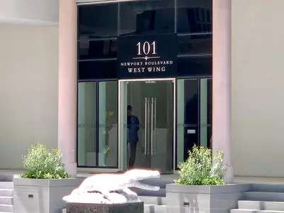 a statue of a bird in front of a building at Chillax Studio 101 Newport Boulevard in Manila