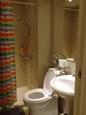 a bathroom with a toilet and a sink at Azure C6 Balcony Wifi near Mall Airport MULTIPL UNITS in Manila