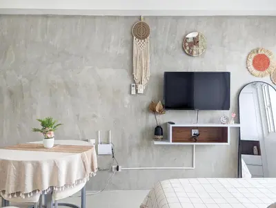 a living room with a table and a tv at Studio Condo Manila by the Bay Roxas Blvd near US Embassy in Manila