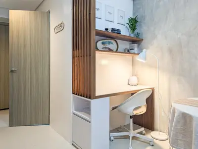 a room with a desk and a chair and a bed at Studio Condo Manila by the Bay Roxas Blvd near US Embassy in Manila