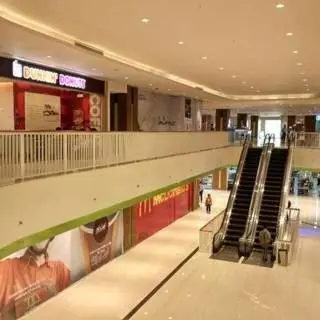an empty shopping mall with escalators in the middle at Makati Condo Edsa MRT Magallanes Station Chino Roces Ave cor EDSA IT Hub ONE Ayala Alphaland WiFi by 24K Residences in Manila