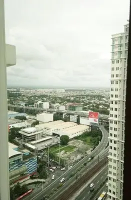 a view of a city from a tall building at Makati Condo Edsa MRT Magallanes Station Chino Roces Ave cor EDSA IT Hub ONE Ayala Alphaland WiFi by 24K Residences in Manila