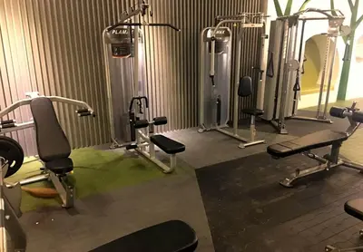 a gym with a bunch of cardio equipment in it at EV Place in Manila