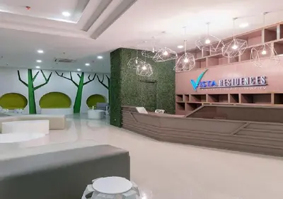 a lobby with a vtec resources sign on a wall at EV Place in Manila