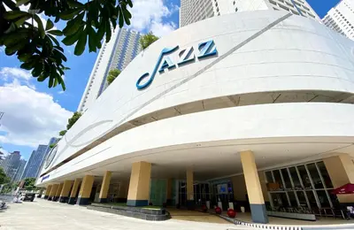 aana building with a sign on the side of it at Will’s Place at Jazz Makati in Manila