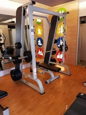 a gym with two treadmills and a treadmill at The Palm Tree Condotel Manila Airport in Manila