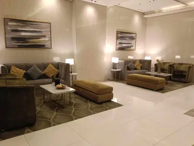 a living room with couches and chairs and a table at Condo Unit walking distance to Manila Airport (NAIA Terminal 3) in Manila