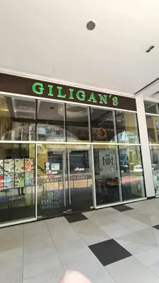 a store with glass doors in a shopping mall at Condo Unit walking distance to Manila Airport (NAIA Terminal 3) in Manila