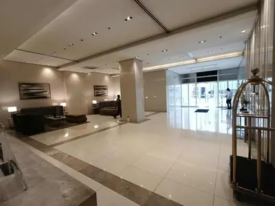 a large room with a lobby with a couch and a lobby at Condo Unit walking distance to Manila Airport (NAIA Terminal 3) in Manila
