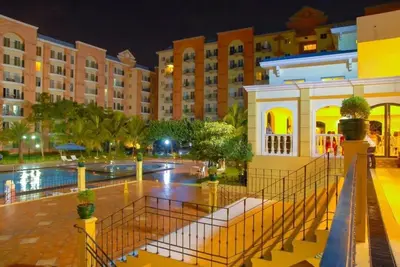 a view of a large building at night at CHATEAU ELYSEE a6 near AIRPORT Wifi Kitchen in Manila