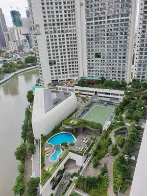 an aerial view of a building with a tennis court at ACQUA Private Residences 1BR Condo in the heart of downtown Makati & Mandaluyong in Manila