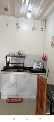 a kitchen with a counter top with a stove at Mavs transient inn kassel residences in Manila