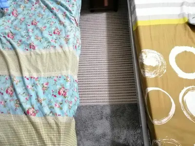 an escalator leading up to a bed in a room at Condo Near NAIA Airport T 1,2,3&4 v4 in Manila
