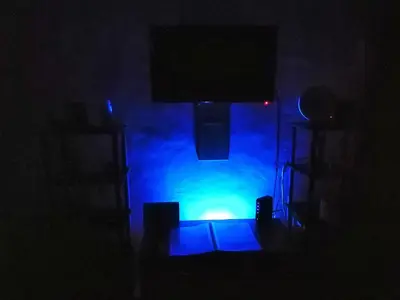 a dark room with a stage with blue lights at Condo Near NAIA Airport T 1,2,3&4 v4 in Manila