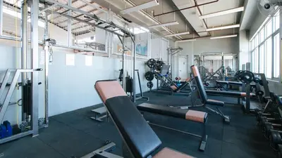 a gym with several treadmills and machines at RedDoorz Plus @ E Rodriguez Corner Banawe in Manila