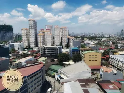 a view of a city with tall buildings at Macks Awesome Place 05 with Netflix and FastUnliwifi in Manila