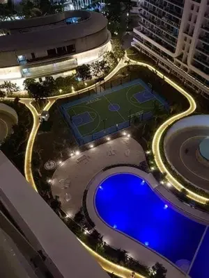 an overhead view of a swimming pool at night at AZURE C5 MAN-MADE BEACH BALCONY Multiple Units in Manila