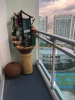 a balcony with potted plants and a view of a city at AZURE C5 MAN-MADE BEACH BALCONY Multiple Units in Manila