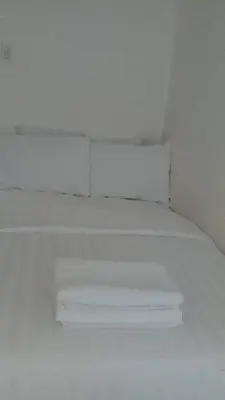 a white shelf in a room with a white ceiling at AZURE C5 MAN-MADE BEACH BALCONY Multiple Units in Manila