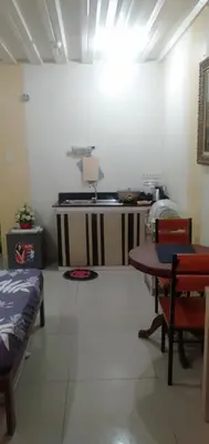 a room with a table and a bed and a table at EKONUMI ROOMS at Moonwalk Paranaque in Manila